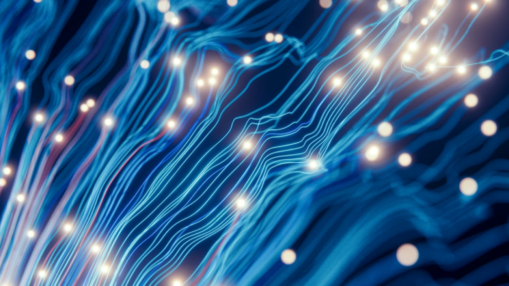 Abstract design showing flashes of lights over streams of blue.