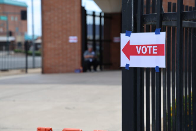 A sign saying vote